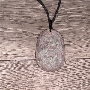 Dragon and Phoenix carved stone pendant